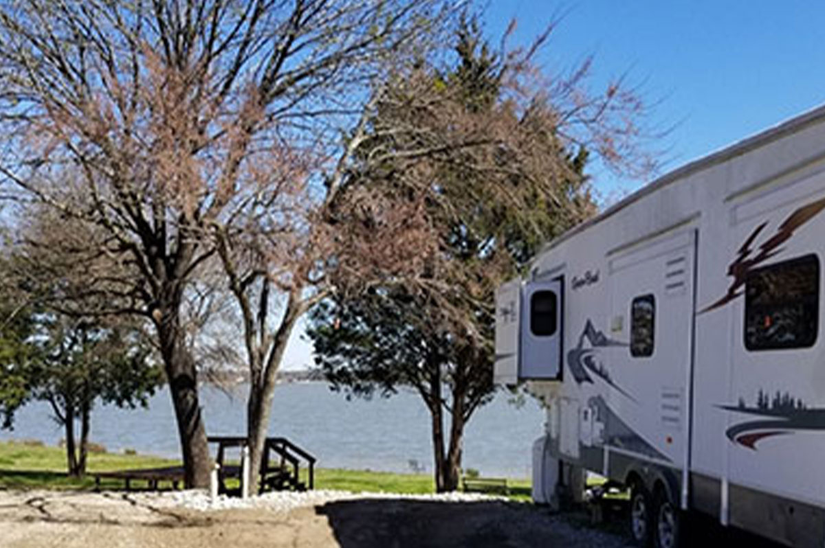 RV parked next to a beautiful view of Lake Fork