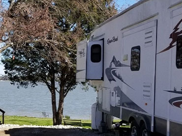 RV parked next to the water