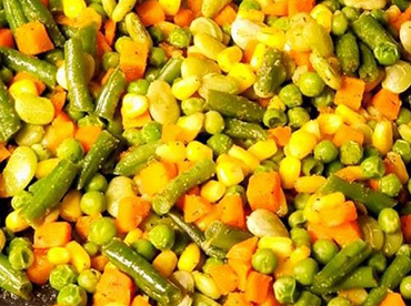 Close-up of vegetable medley with corn, green beans, carrots and peas 